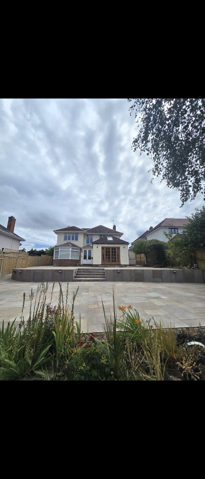 Indian sandstone patio and central steps leading up to the house in Taunton, before the railings were fitted
