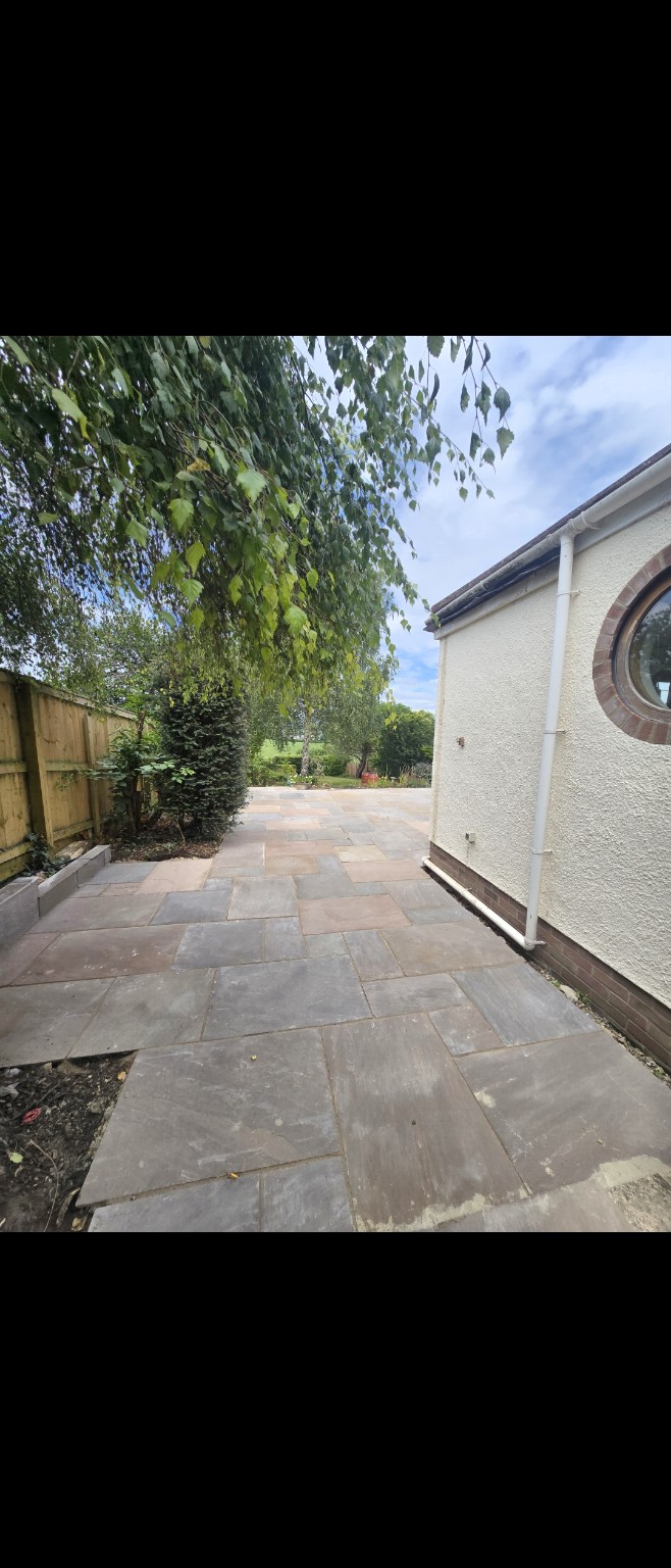 Indian sandstone side path connecting the house and open patio in Taunton