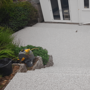 small garden with raised beds and retaining wall