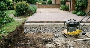 Correct driveway build-up showing compacted sub-base beneath block paving